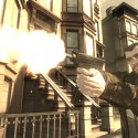 Niko fires an Uzi submachine gun.